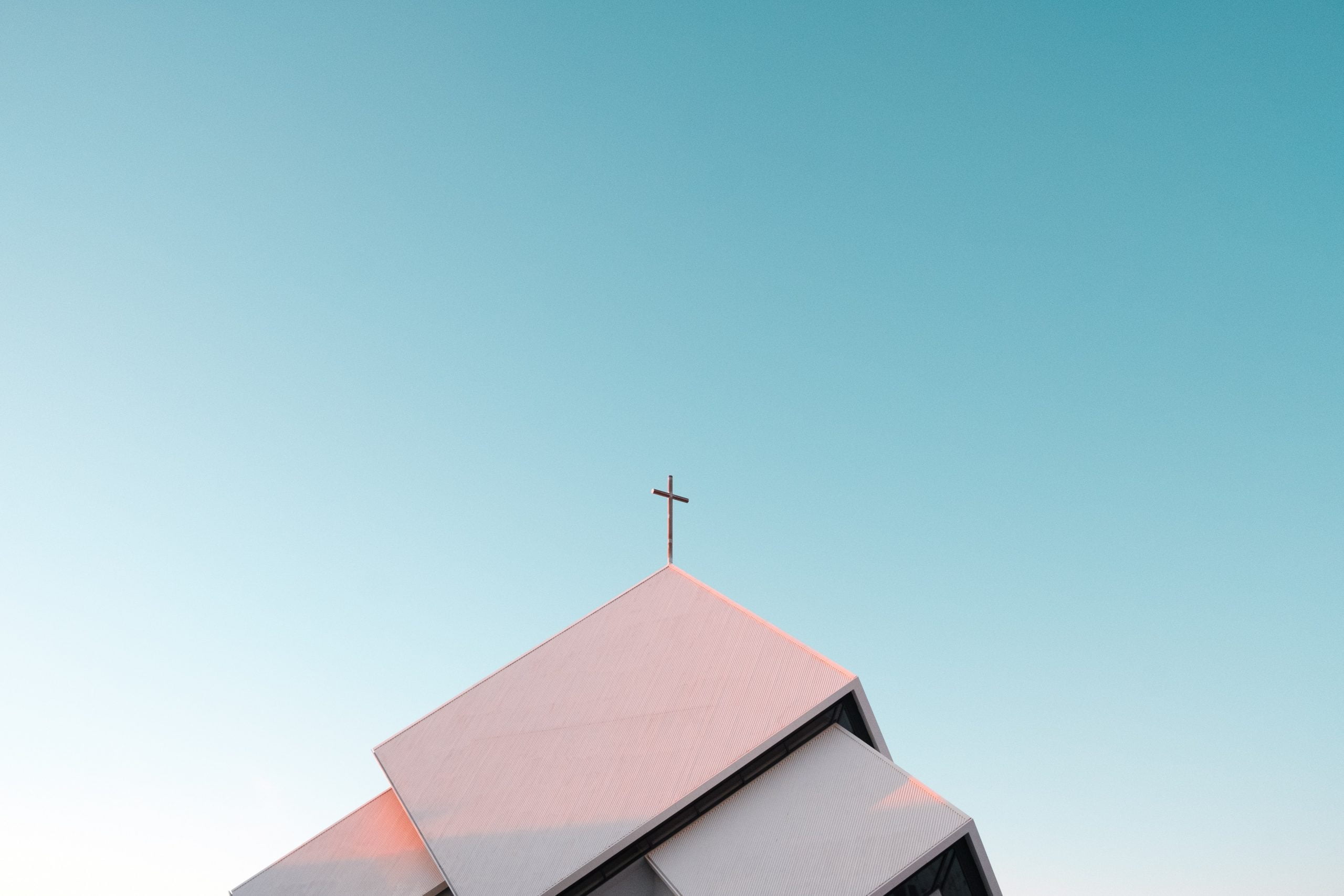 a cross on top of a roof
