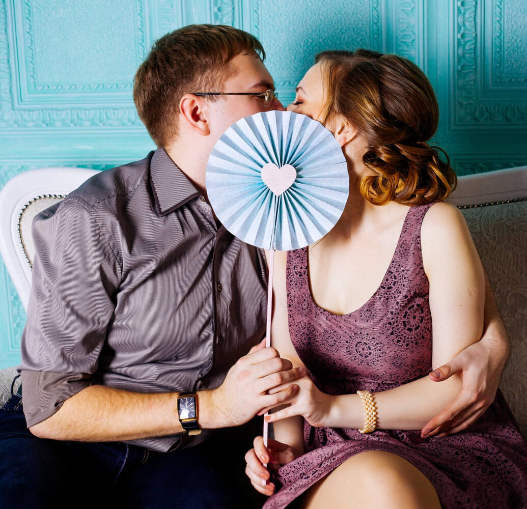 a man and woman kissing