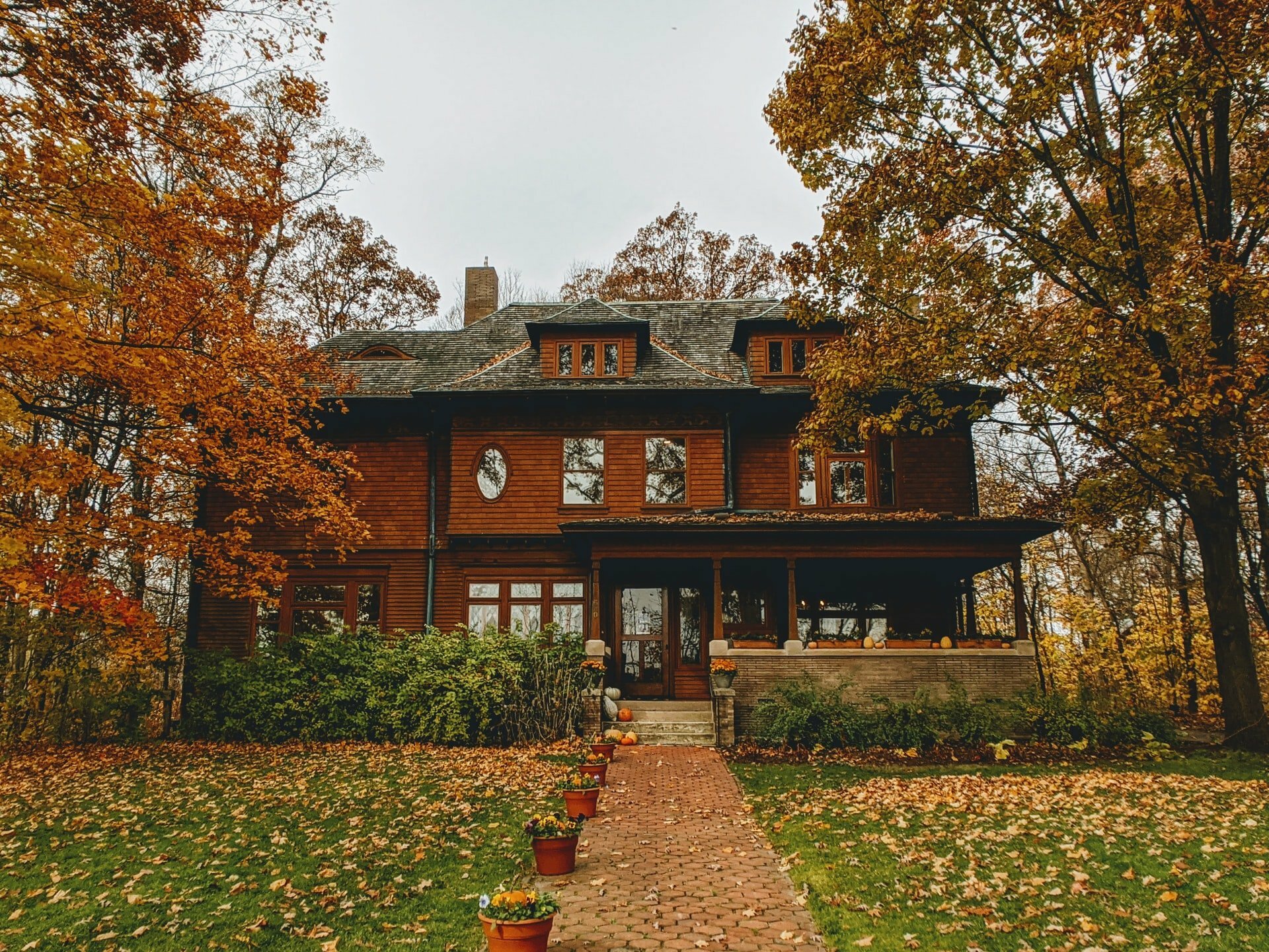 a brick building with trees around it