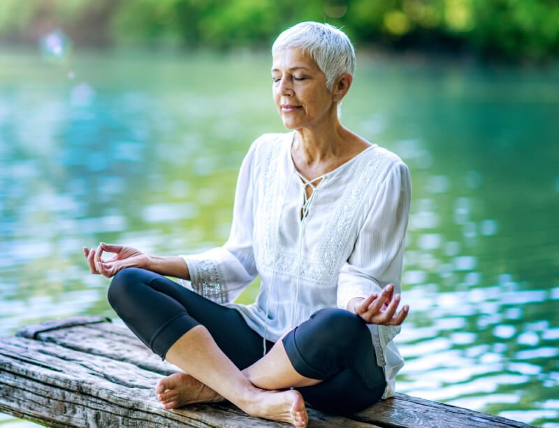 a person sitting on a dock