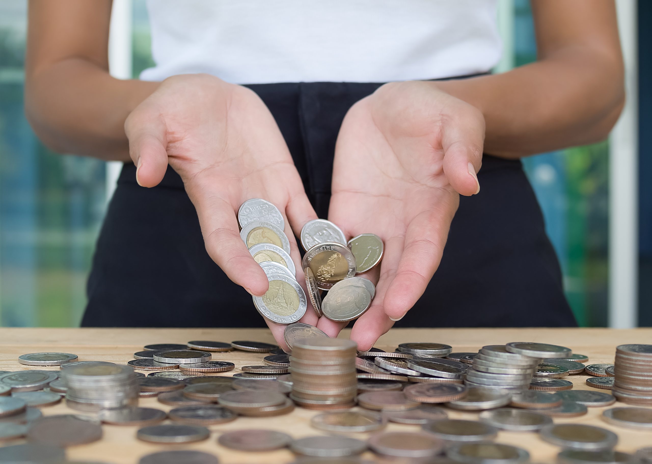 Coin money on palm up